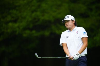 Tomoharu Ostuki suffered 2 shot penalty being late for tee time but still moved up to co-leader