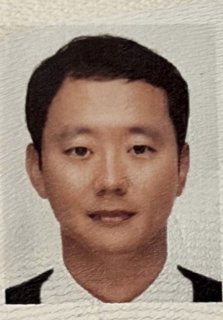 厳 載雄